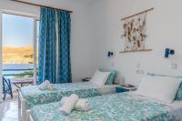 Postel nebo postele na pokoji v ubytování Antoniadi Rooms