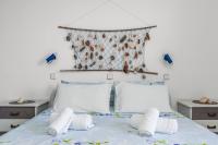 Postel nebo postele na pokoji v ubytování Antoniadi Rooms