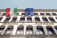 two flags on the side of a building at Hotel Firenze in Venice