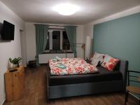 Postel nebo postele na pokoji v ubytování Apartmán Krkonoše
