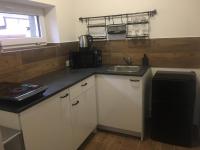 Kuchyň nebo kuchyňský kout v ubytování Apartmán Krkonoše
