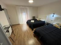 Posteľ alebo postele v izbe v ubytovaní Hostal ARS