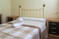 A bed or beds in a room at Apartamento Completo Torresol V