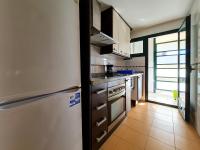 A kitchen or kitchenette at Apartamento Completo Torresol V
