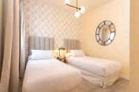 A bed or beds in a room at Genteel Home Feria