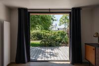 an open door with a view of a patio at Les Chambres d&#39;Hôtes de Bordustard in Le Palais