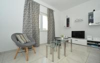 Televízia a/alebo spoločenská miestnosť v ubytovaní Holiday Home Mery