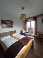 Posteľ alebo postele v izbe v ubytovaní Garni Hattlerhof B&B
