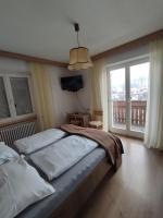 Posteľ alebo postele v izbe v ubytovaní Garni Hattlerhof B&B