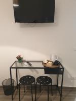 Telewizja i/lub zestaw kina domowego w obiekcie Residenza Tarzanà