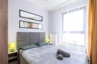 Posteľ alebo postele v izbe v ubytovaní Dąbska Street Krakow - Luxury Apartments