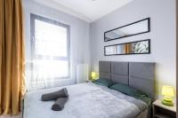 Posteľ alebo postele v izbe v ubytovaní Dąbska Street Krakow - Luxury Apartments