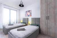 Posteľ alebo postele v izbe v ubytovaní Dąbska Street Krakow - Luxury Apartments