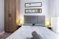 Posteľ alebo postele v izbe v ubytovaní Dąbska Street Krakow - Luxury Apartments