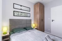 Posteľ alebo postele v izbe v ubytovaní Dąbska Street Krakow - Luxury Apartments