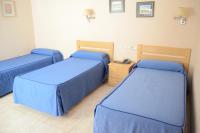 Postel nebo postele na pokoji v ubytování Hotel Legazpi