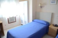 Postel nebo postele na pokoji v ubytování Hotel Legazpi