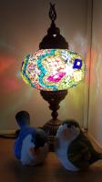 two birds sitting next to a stained glass lamp at Hai Yang Feng Qing Homestay in Hualien City