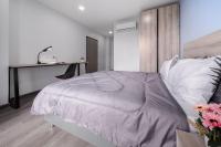 Postel nebo postele na pokoji v ubytování Aqua Residences อควา เรสซิเดนซ์ ห้องพักใหม่ให้เช่า ติดรถไฟฟ้าสถานีวุฒากาศ