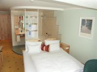 Un ou plusieurs lits dans un hébergement de l&#39;établissement Hotel Alpina nature-wellness