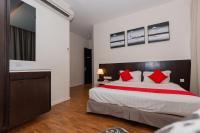MIO BOUTIQUE Hotelにあるベッド