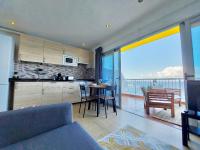 A kitchen or kitchenette at Coastview Terrace Studio by TOR