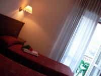 Posteľ alebo postele v izbe v ubytovaní HOTEL BELVEDERE