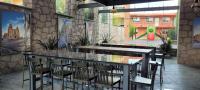 a restaurant with a table and chairs and a playground at Hotel Camino de Piedra in Guanajuato
