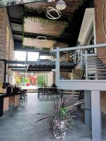 a staircase in a building with tables and chairs at Hotel Camino de Piedra in Guanajuato