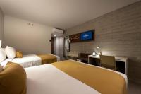 Microtel Inn & Suites by Wyndham Guadalajara Surにあるベッド