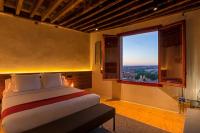 A bed or beds in a room at Casa Palacio Rodrigo de la Fuente by Príncipe David - Seis Apartamentos de Lujo -