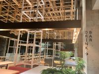 a view of a restaurant with tables and chairs at AMANEK Beppu YULA-RE in Beppu