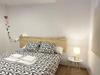 A bed or beds in a room at Selva La Bella. En el Corazón de Triana