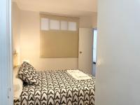 A bed or beds in a room at Selva La Bella. En el Corazón de Triana
