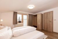 A bed or beds in a room at Gustls Ferienhäusl