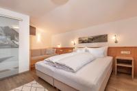A bed or beds in a room at Gustls Ferienhäusl