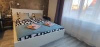 Posteľ alebo postele v izbe v ubytovaní Apartmani Karlo