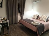 Łóżko lub łóżka w pokoju w obiekcie Residenza Tarzanà