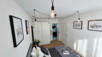 Posteľ alebo postele v izbe v ubytovaní Apartman H8
