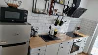 Kuchyňa alebo kuchynka v ubytovaní Apartman H8