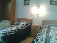 Postel nebo postele na pokoji v ubytování Hotel Los Nogales