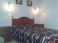 Postel nebo postele na pokoji v ubytování Hotel Los Nogales