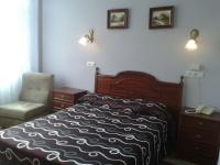 Postel nebo postele na pokoji v ubytování Hotel Los Nogales