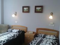 Postel nebo postele na pokoji v ubytování Hotel Los Nogales