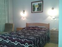 Postel nebo postele na pokoji v ubytování Hotel Los Nogales