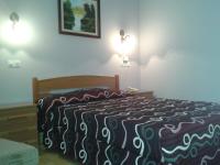 Postel nebo postele na pokoji v ubytování Hotel Los Nogales