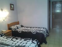 Postel nebo postele na pokoji v ubytování Hotel Los Nogales