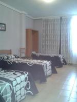 Postel nebo postele na pokoji v ubytování Hotel Los Nogales