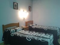 Postel nebo postele na pokoji v ubytování Hotel Los Nogales