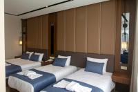 Postel nebo postele na pokoji v ubytování Martinenz Hotel